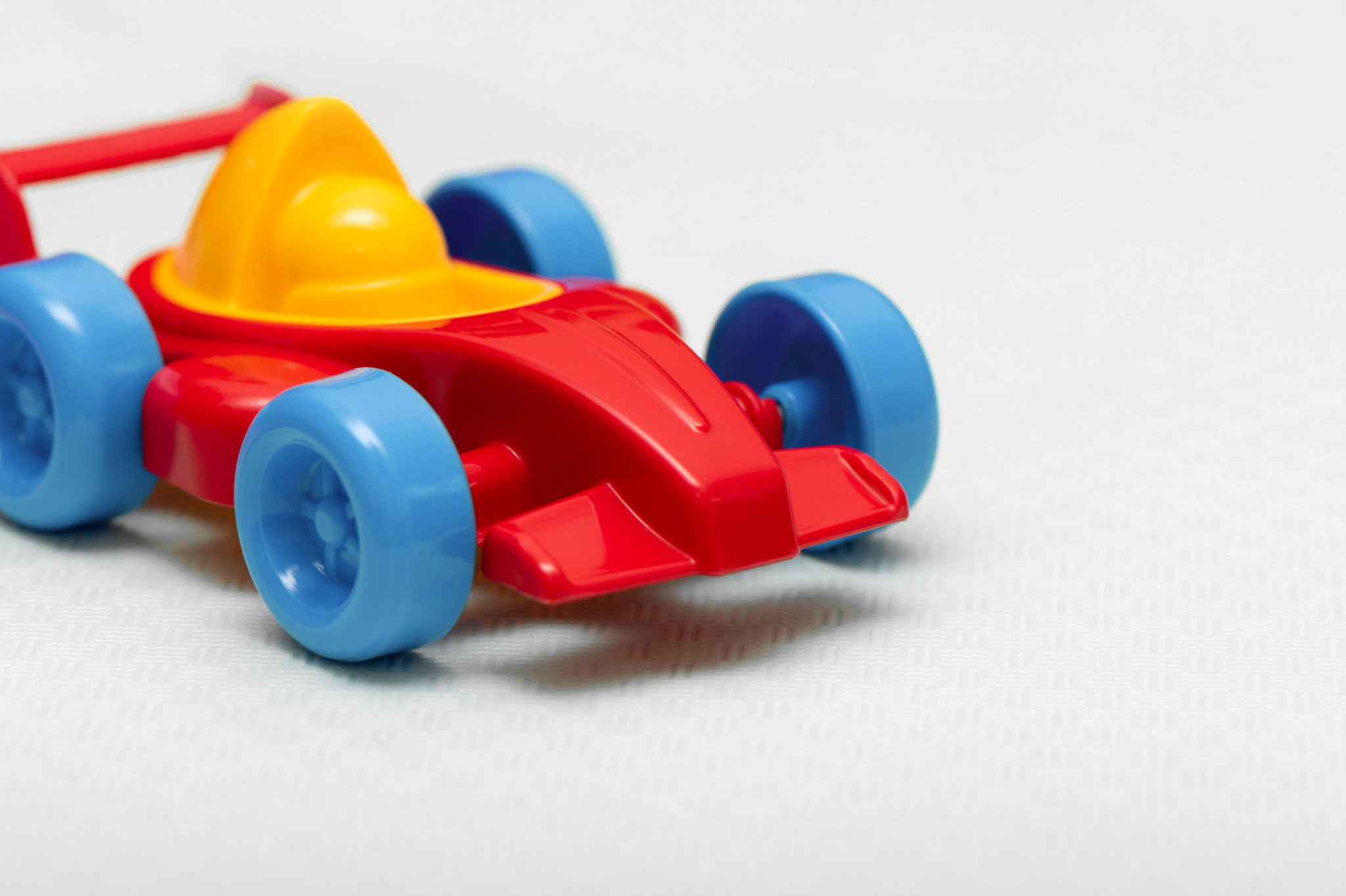 Children's toy plastic red machine, close up.
